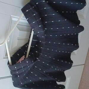 A candies black skirt with white lines.